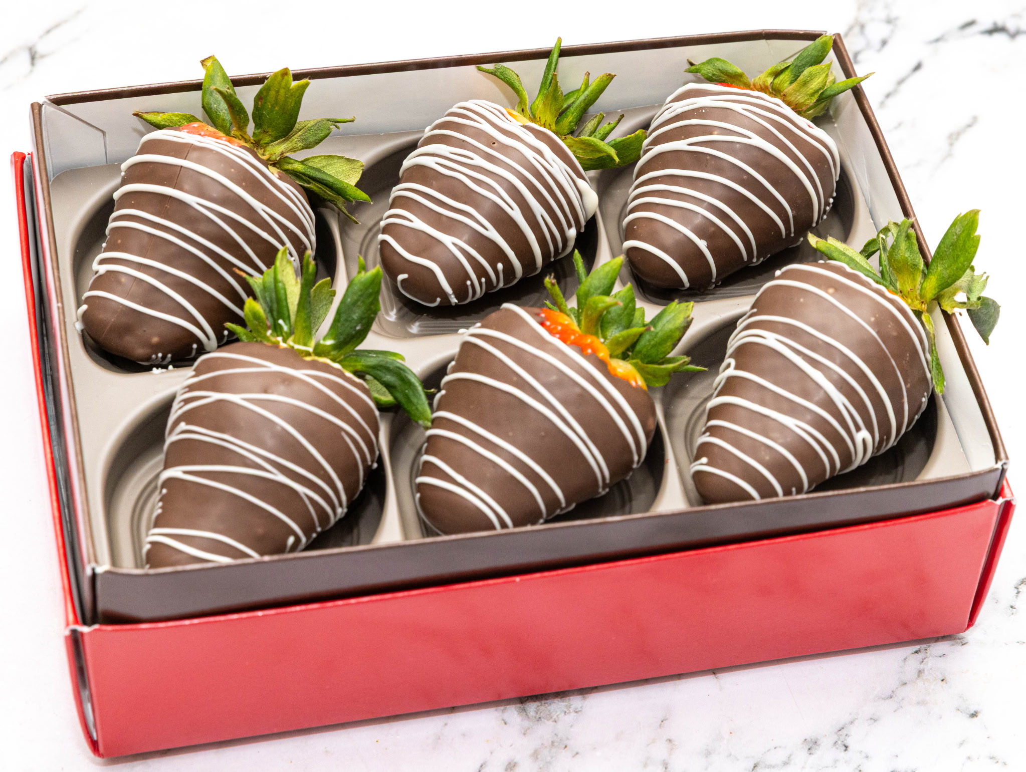 Chocolate-covered strawberries in gift box