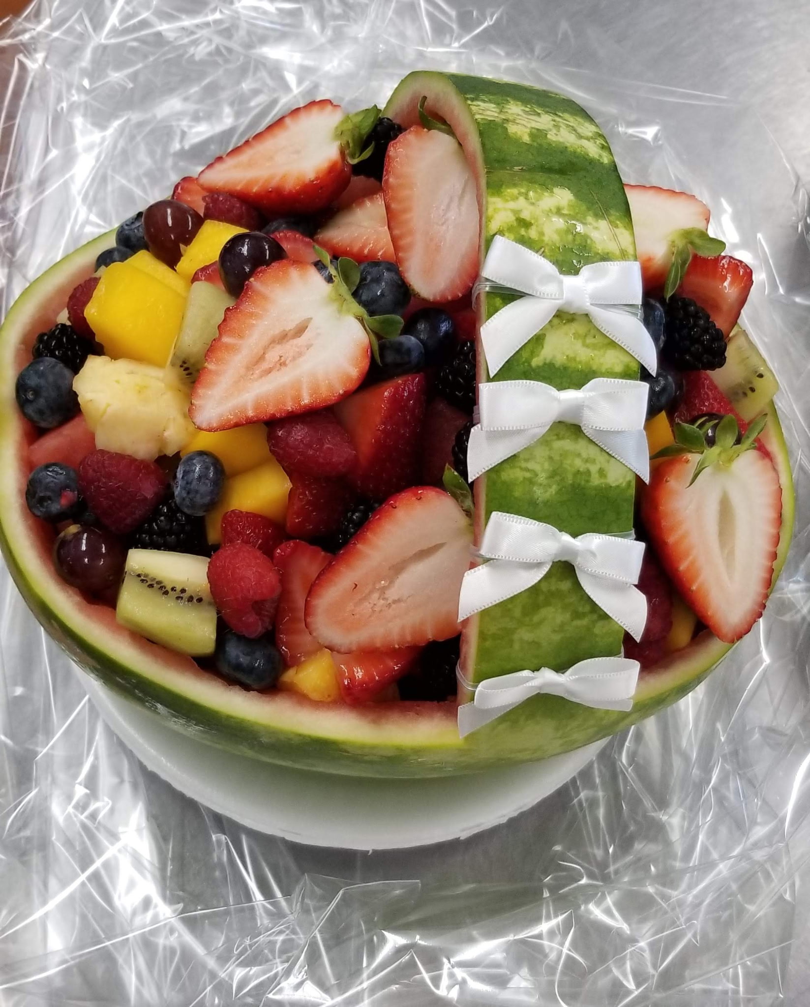 Watermelon basket with fresh fruit and bow